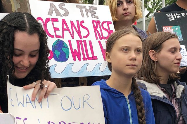 This is a photo of teenage climate activist Greta Thunberg, demonstrating outside the United Nations in New York City.